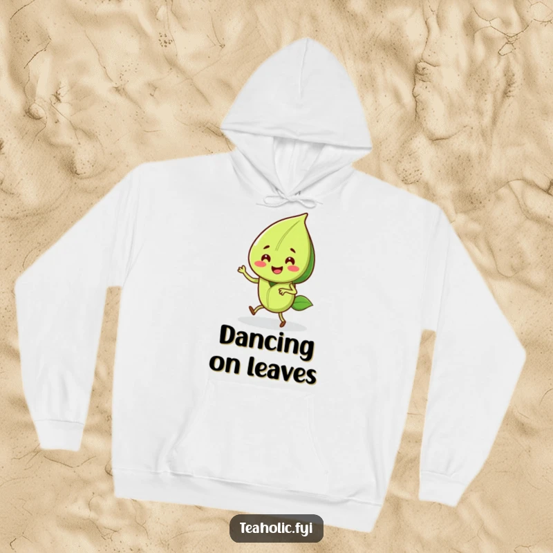 Funny hoodie with a smiling tea leaf character doing a joyful jig, perfect for staying warm and happy.
