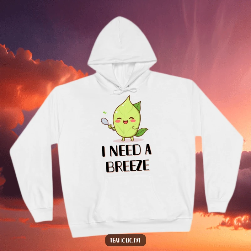 Funny smiling tea leaf character fanning itself with a tiny spoon, a cozy and funny hoodie.