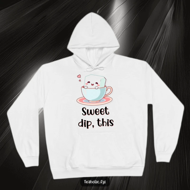 Funny hoodie showcasing a joyful sugar cube character enjoying a swim inside a teacup. Comfortable and comical winter wear.